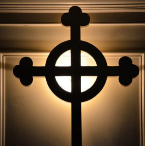 a cross in light and shadows