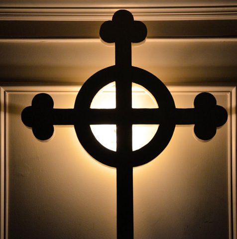 a cross in light and shadows
