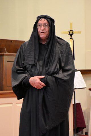 a man in dark costume