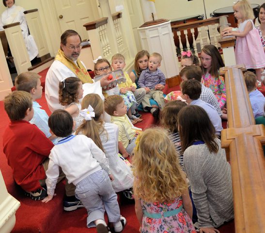 Pastor Larry reading to children
