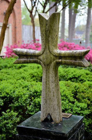 a stone cross outdoors