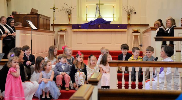 children listening to the pastor
