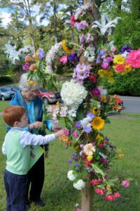 putting flowers on the cross