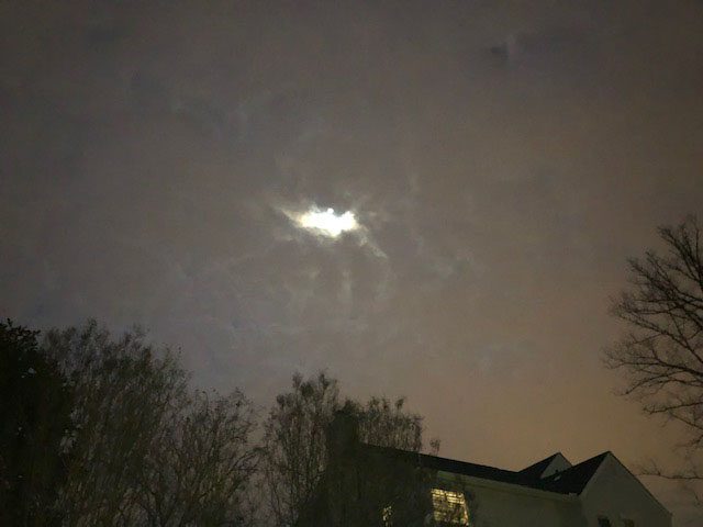 clouds over a house at night