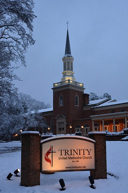 Trinity sign and steeple in the snow