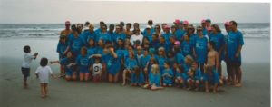 a group photo from 1993 on Sunset Beach families in matching shirts